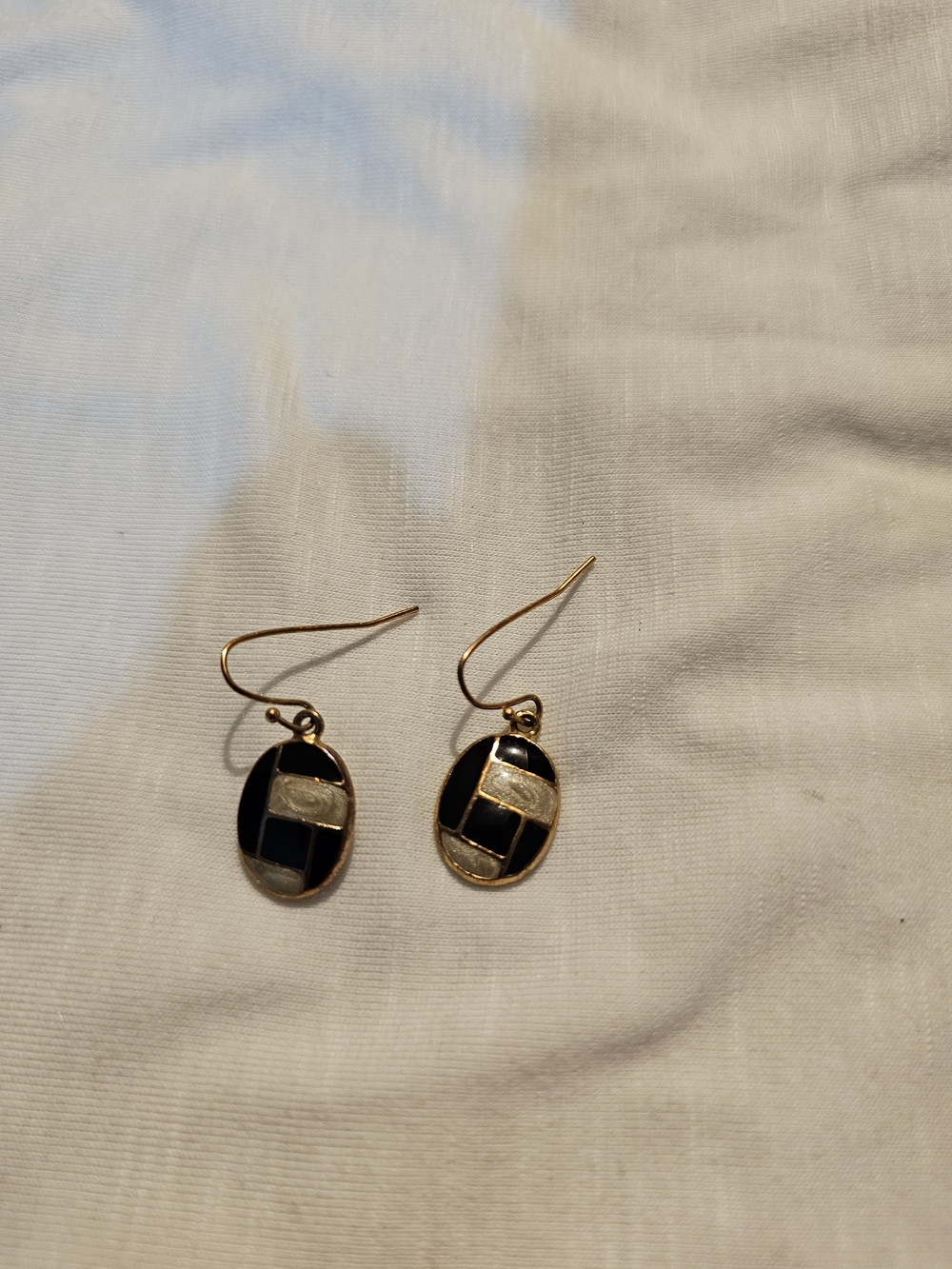 Gold-Tone Black Inlay Oval Drop Earrings with Geometric Accent